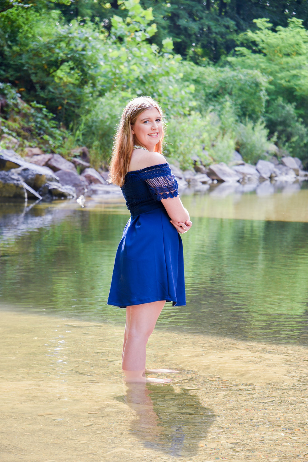 You can tell Emily is an outdoorsy girl. She didn't think twice about ditching the shoes and hoping in the water for some shots. 