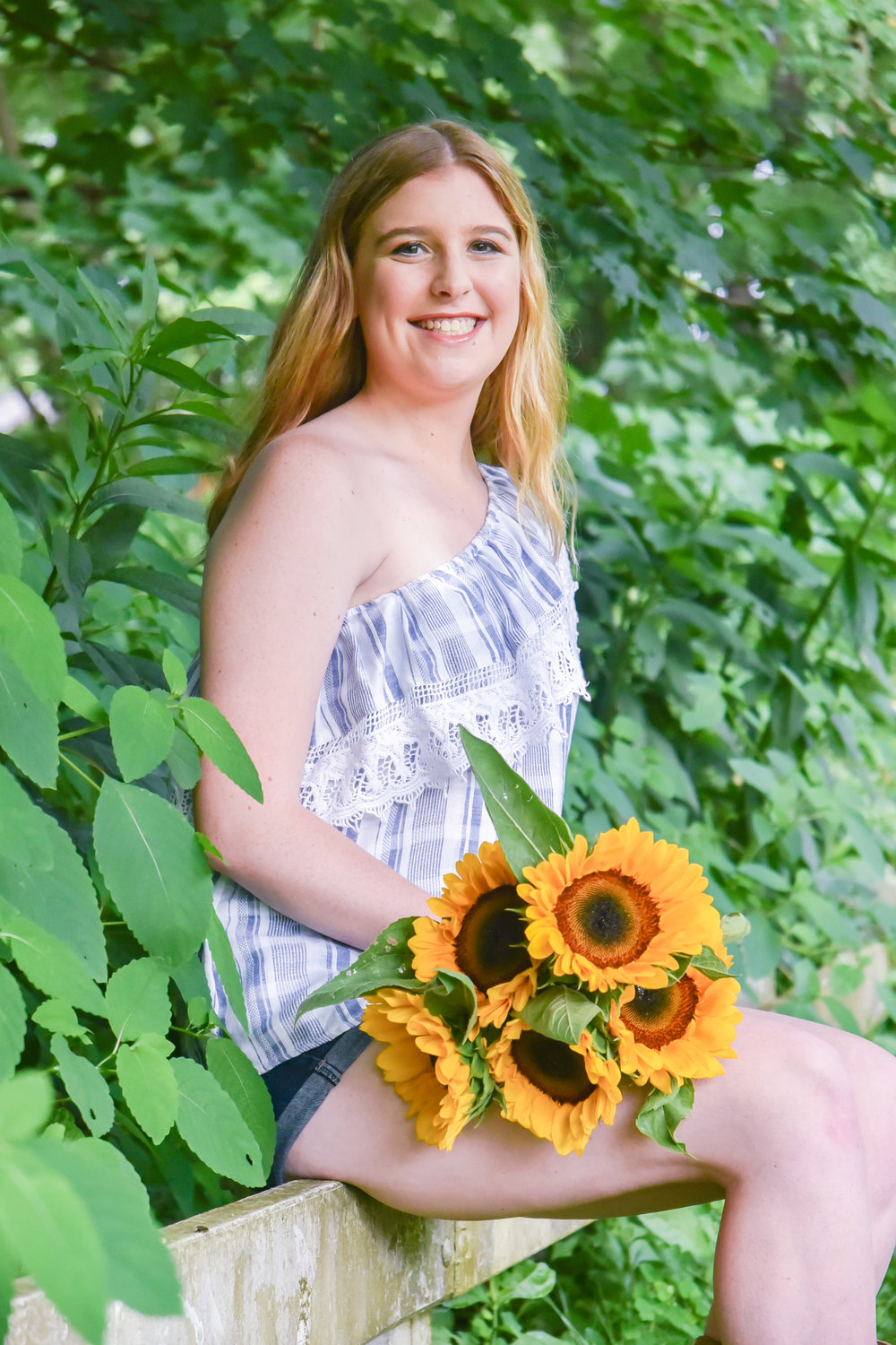 One of my favorite things about this shoot is that Emily came with these beautiful sunflowers and cowboy boots. 