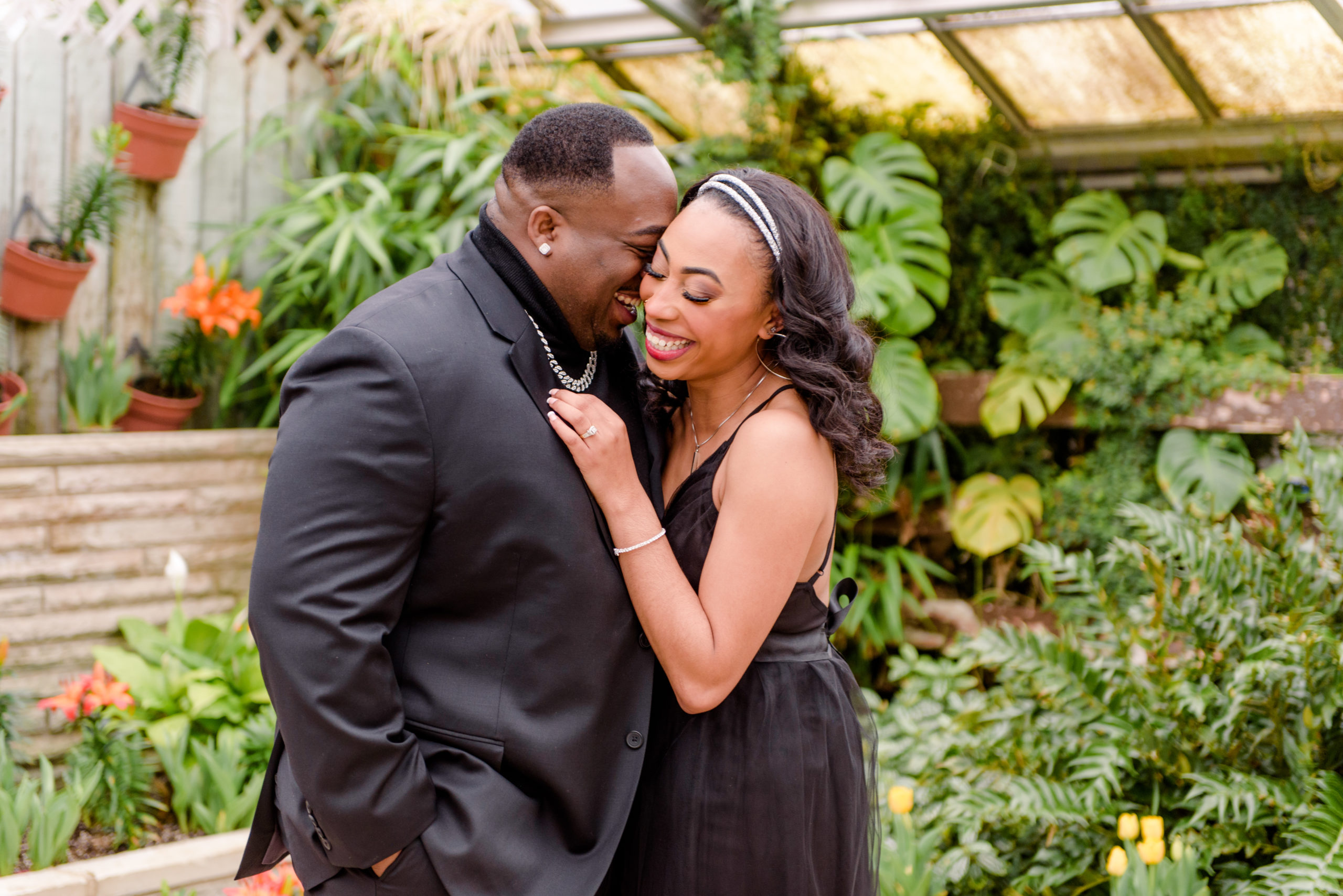 Couple embracing in a greenhouse in Cleveland Ohio